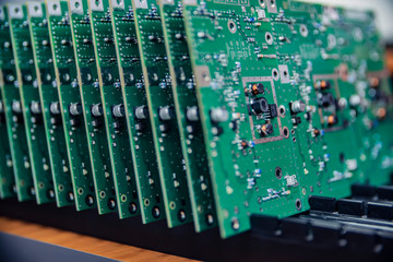 a lot of electronic chips close up on a factory production background