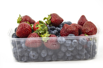 Fresh strawberries. Strawberry background. Macro texture. big, big strawberries. On a white background. blueberry. Harvesting clean local strawberries.