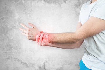 Hand pain. Medical and pharmaceutical concept. People's health problems, the man is holding his...