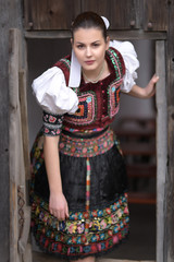 Beautiful slovak woman in traditional costume. Slovak folklore.