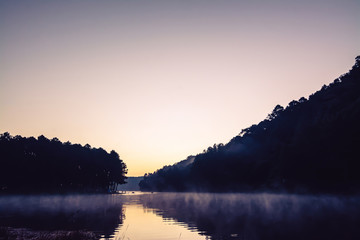The landscape of the reservoir and the morning fog