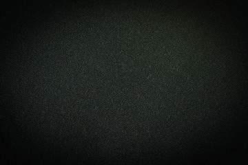 Black fabric, luxury dark gray background abstract. Material are used in textile assembly. Detail cloth texture of pattern. Design, elegance with vignette effect, free copy space for text placement.