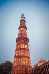 Fototapeta na wymiar New Delhi: Qutub (Qutb) Minar, the tallest free-standing stone tower in the world, and the tallest minaret in India, constructed with red sandstone and marble in 1199 AD. Unesco World Heritage. India