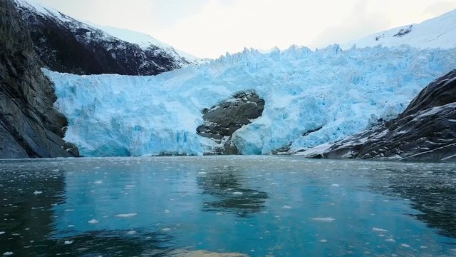 4k Aerial flying over blue ice glacier 