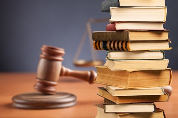 Collection stack of old retro books and justices gavel