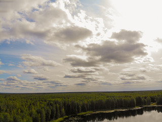 Aerial shooting of a magic lake in the taiga of Russia