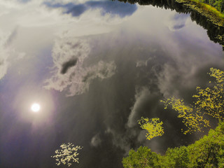 Aerial shooting of a magic lake in the taiga of Russia