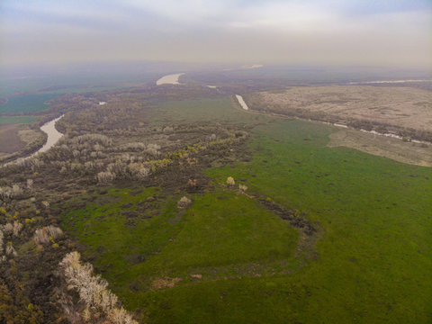 Aerial shooting a river, fields and trees in the Rostov region of Russia