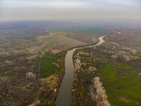 Aerial shooting a river, fields and trees in the Rostov region of Russia