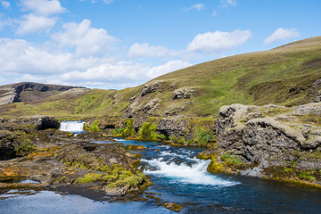 Fototapeta na wymiar Waterfall and cascade in river Nordari Ofaera near Eldgja in Iceland