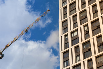 Construction of a modern residential complex. The construction of a multi-story building. cargo crane