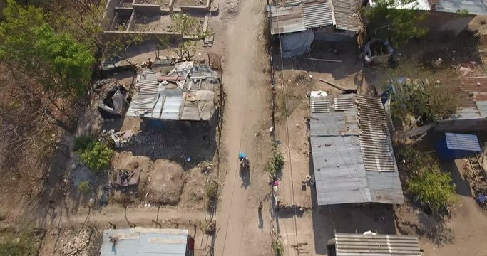 4k Aerial Top Down of children on a Dirt Road in Honduras