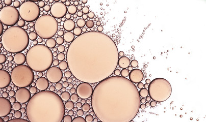 Bubbles abstract macro extreme closeup in peach isolated on a white background