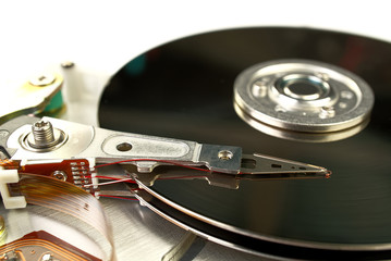 Detail of reading - writing head of hard drive. Close up inside of Hard disk drive - HDD . Hard disk for PCs, databases, banks, storage of personal data requires virus protection and timely