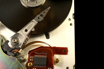 Detail of reading - writing head of hard drive. Close up inside of Hard disk drive - HDD . Hard disk for PCs, databases, banks, storage of personal data requires virus protection and timely