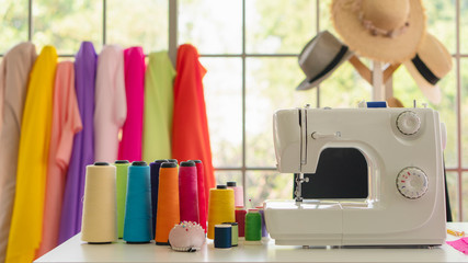 dressmaker shop background of sewing machine with colorful spool of thread