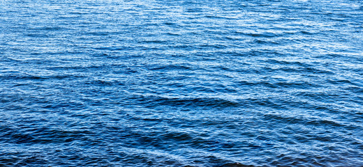 background. light breeze with waves on a blue lake / river / sea