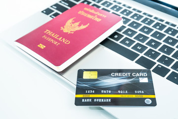 Credit card and passport on keyboard