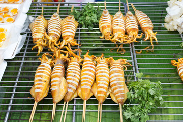 Barbecued squid on a stall on Boat Avenue market, Phuket, Thailand