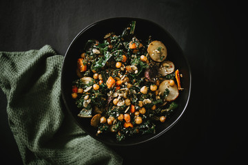 Bowl of Salad with roasted veggies, chickpeas, potatoes, and kale