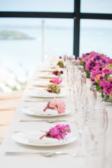 Wedding party, bride and groom with champagne flutes on wedding banquet