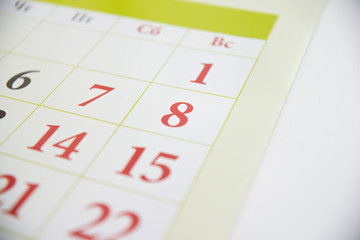 Green calendar with holidays. Close up