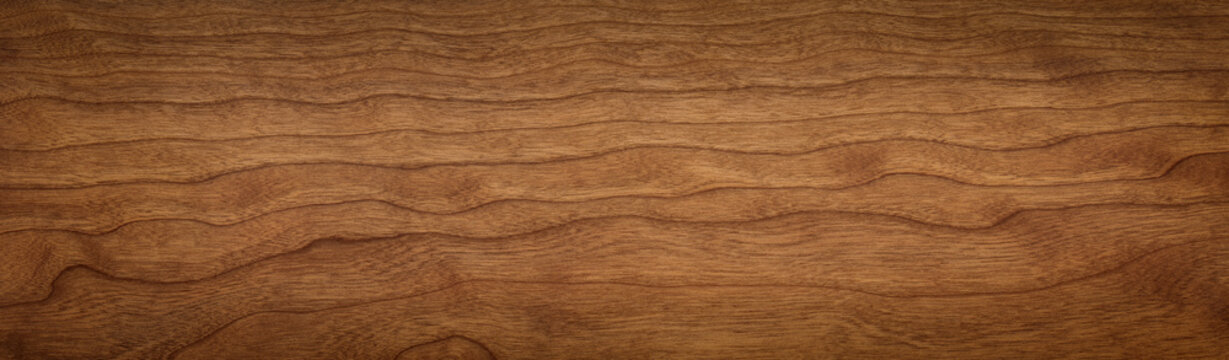 Walnut color wooden board texture background. Extra long wooden board texture background. Dark tone cherry wood plank background. Texture element.