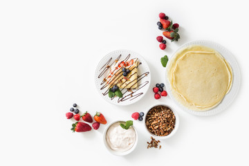 Crepes with berries and cream on White Background