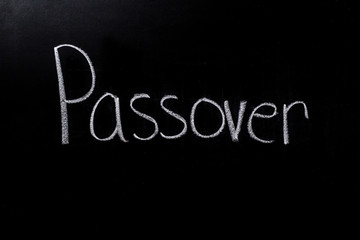 Fototapeta na wymiar Passover written in chalk on chalkboard