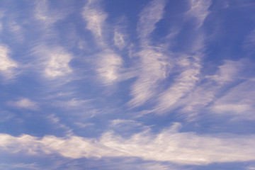 evening blue sky with high cirrus clouds to change weather