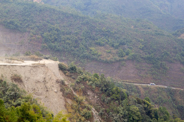 a dirty road along the mountain at northern of Laos