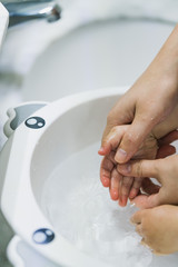 Asian mothers washing hands for infants