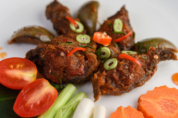 Spicy Fried Stir Catfish on white plate, Thai food.
