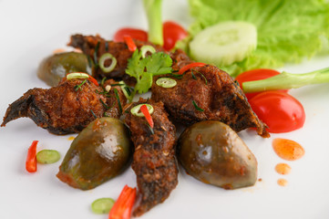 Spicy Fried Stir Catfish on white plate, Thai food.