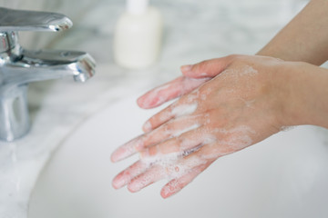 Obraz na płótnie Canvas Hand features of Asian women washing their hands
