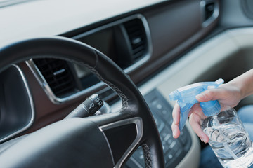 Obraz premium Asian women disinfect and clean car interior