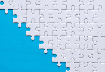 Jigsaw puzzle white color,Puzzles pieces grid,Success mosaic solution template,Horizontal on blue...