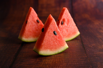 Sliced ​​watermelon on a wooden table.