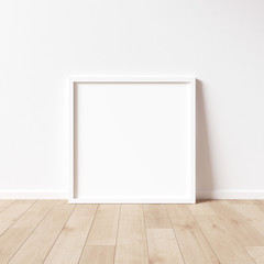 Square white frame mock up on wooden floor with white wall. 3D illustrations.