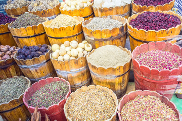 Colorful different spices and herbs in baskets in the spice market in Egypt