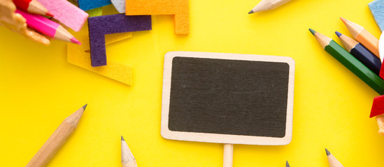 blank sign with pencils,clipper,pin blank sign,english alphabets on pastel background. business concept