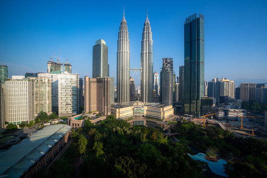 Kuala Lumpur city skyscraper and green space park with nice sky day at downtown business district in Kuala Lumpur. Malaysia. Malaysia tourism, modern city life, or business finance and economy concept