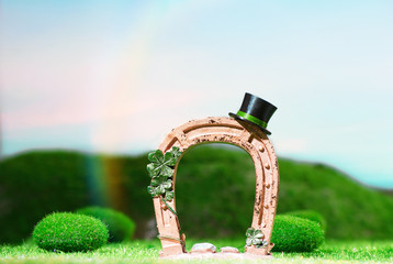 Leprechaun Hat on Gold Horseshoe in Green Meadow