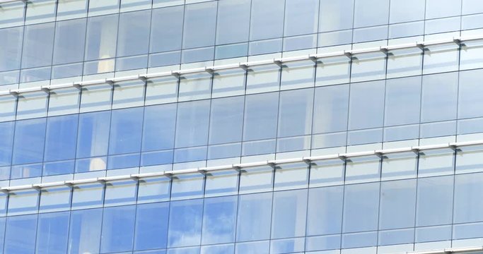Timelapse of clouds in the windows skycraper