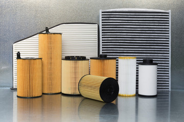Spare parts and accessories for the car. Filters for a car close-up on a steel background.