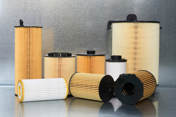 Spare parts and accessories for the car. Filters for a car close-up on a steel background.