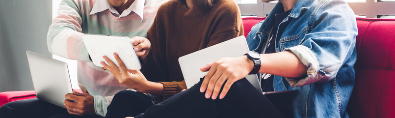 Group of friend sitting relax use technology together of laptop and tablet checking social apps and...