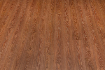 Natural dark brown wooden surface floor texture background.  polished  laminate  parquet
