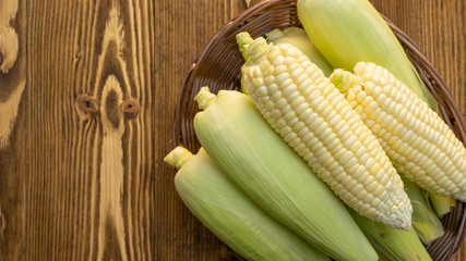 Pure white corn on a wooden table.