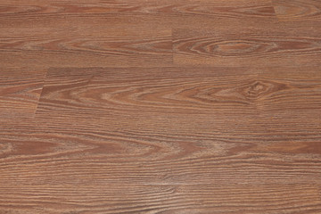 Natural dark brown wooden surface floor texture background.  polished  laminate  parquet